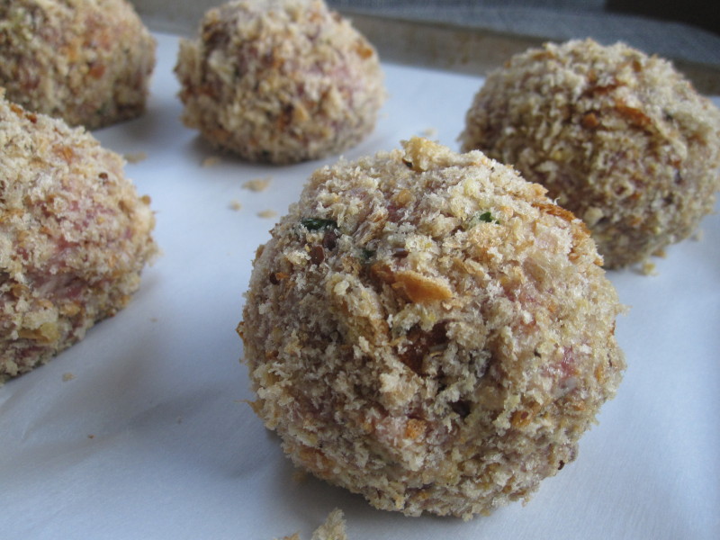 Scotch eggs breaded and ready to bake